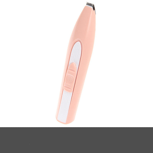 Electric pet grooming clipper trimming a dog's coat at home