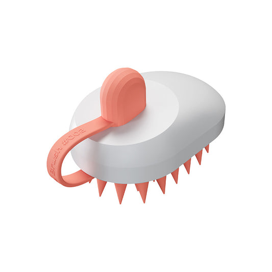 Soft silicone grooming brush working shampoo into a dog's coat