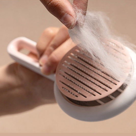 Pet grooming brush releasing collected fur with one-click button