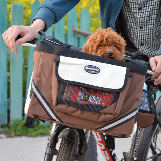 Small dog riding in a front-mount bike basket carrier