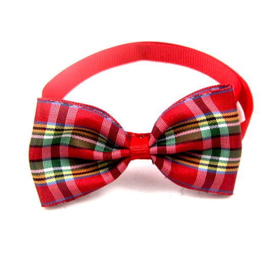 Dog wearing an adjustable plaid bow tie collar