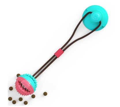 Textured suction cup tug toy that cleans a dog's teeth