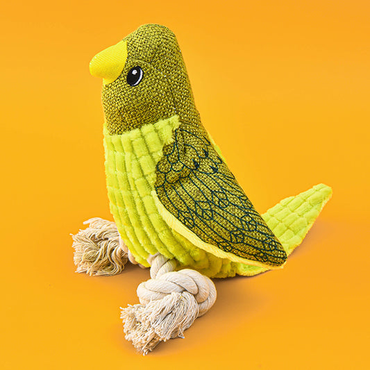 Dog playing with a squeaky plush bird toy from Petnki